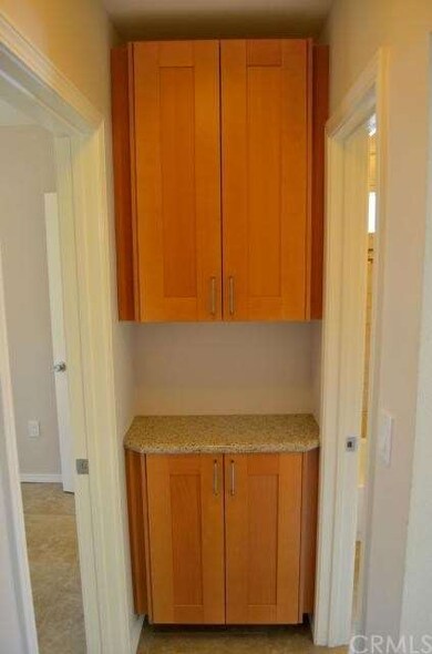 IKEA cabinets with granite counter in hallway