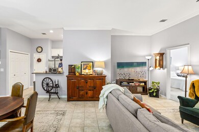 Living room with baseboards, ornamental molding, 