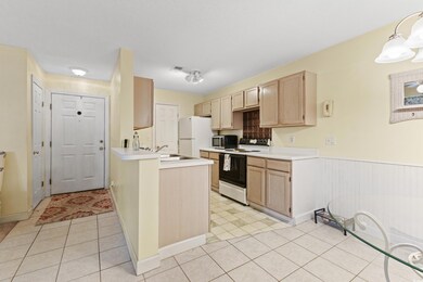 Kitchen with sink, pendant lighting, light tile pa