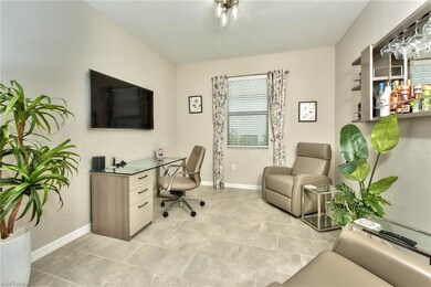 Den with tile floor & upgraded light fixture - dou