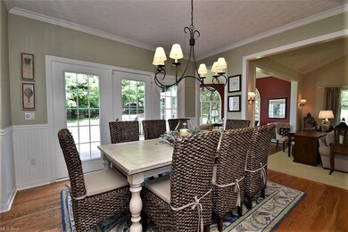 Large eat-in kitchen with hardwood floors, crown m