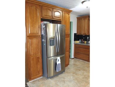Kitchen has a pantry and lots of cabinet space.
