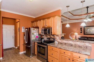 Bright, light filled kitchen has maple cabinets an