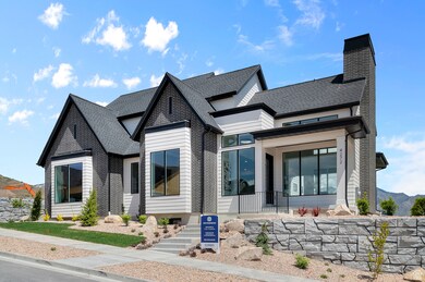 Contemporary house featuring a shingled roof, a chimney, and covered porch
