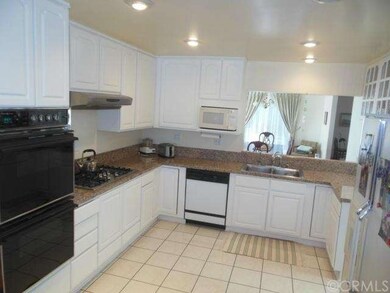 Spacious kitchen with freshly painted cabinetry an
