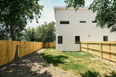 Back of house featuring stucco siding