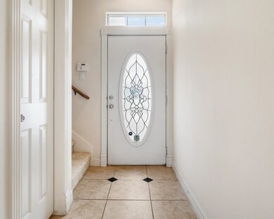 Entry way with stairs leading to bedrooms