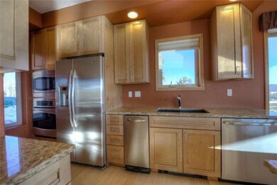 Stainless steel appliances include microwave, wall