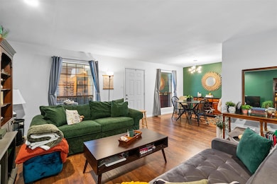 Living room featuring a chandelier and wood finis