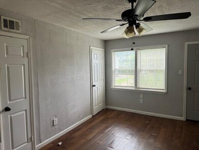 Spare room with dark hardwood / wood-style floors 