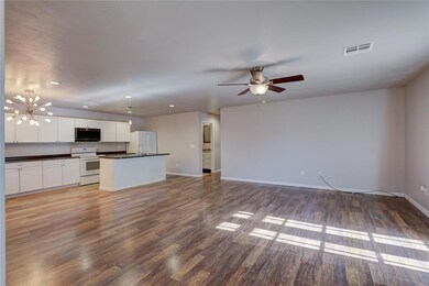 Unfurnished living room with hardwood / wood-style