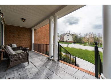 Covered front porch with stamped concrete flooring