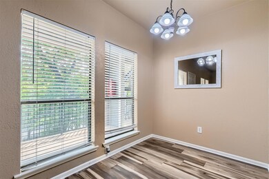Empty room featuring a chandelier, wood finished 