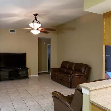 FAMILY ROOM WITH VIEW TO BEDROOM TWO AND THREE AND