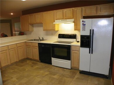 Kitchen with radiant tile flooring.