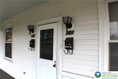 Entrance is the front door, down a hall and through your door to the stairs