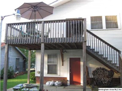 Back of the house, great deck for entertaining! Ea