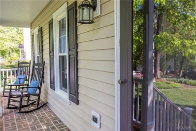 Brick porch perfect for a pair of rockers.
