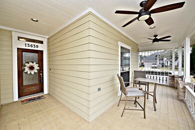 The extended covered porch is the ideal spot to sit back and relax watching the day go by. Shortly the flowers beds will come alive with beautiful established blue plumbago flowers that are just breathtaking.