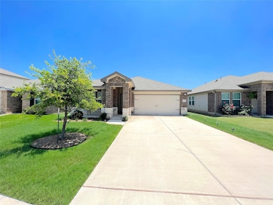 Ranch-style house featuring driveway, an attached