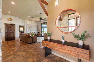 Living room with ceiling fan and recessed lighting