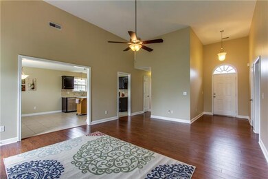 Entertain friends in the open floor plan.  The French door leads to the aggregate patio and the partially fence back yard.