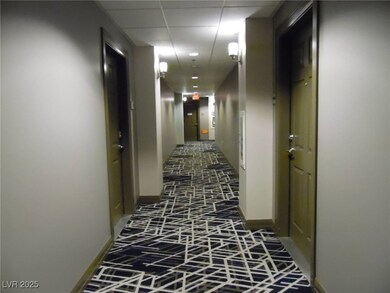 Hall featuring brick floor and baseboards