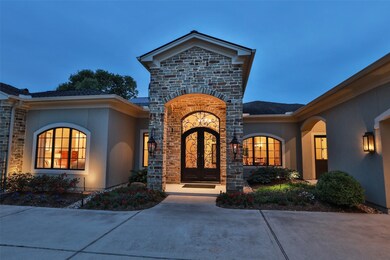 Bevelo gas lights from New Orleans flank the stone front entrance.