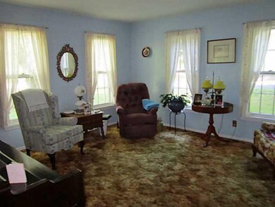 Living Room. 14  x 14 . Sculpted brown wall-to-wal