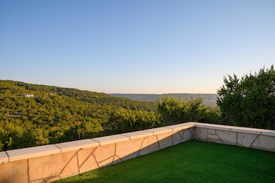 Yard at dusk with a yard and a forest view