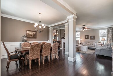 As you enter into the foyer, the dining room and living room flow together boasting beautiful hardwoods and lovely views of the backyard!