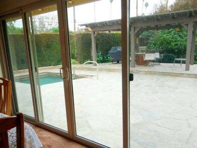 View of the picturesque backyard from the large di