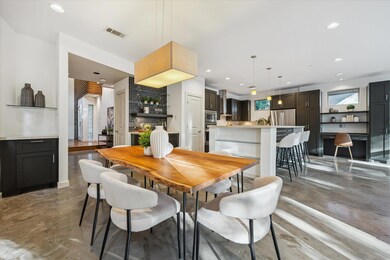 Dining area with finished concrete flooring and r