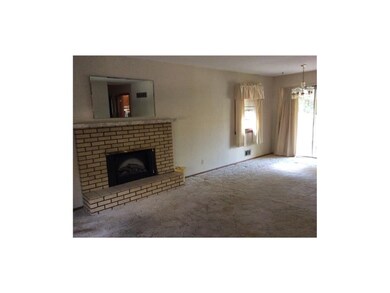 Cozy brick fireplace in living room.