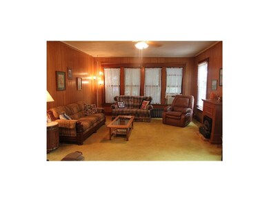 Living Area with Hardwood Floors under Carpet