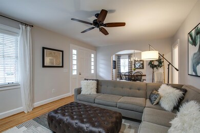 Living room features a wood burning fireplace that was re-lined and restored.