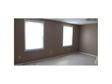 Large master bedroom with new carpet