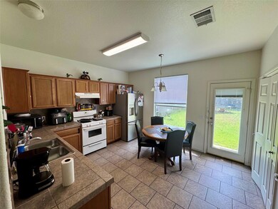 Kitchen featuring white range with gas cooktop, s