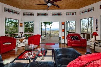 Dramatic Greatroom flanked by windowed walls bring