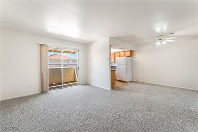 Unfurnished living room featuring light colored ca