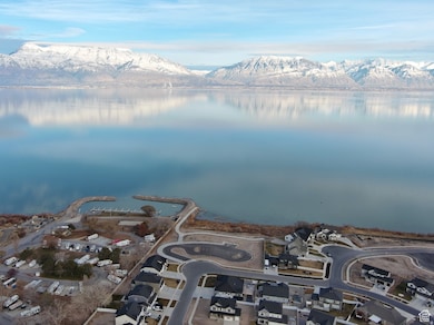 View of property location featuring nearby suburban area and a water and mountain view
