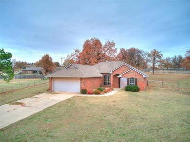 Ranch-style house featuring a garage and a front l