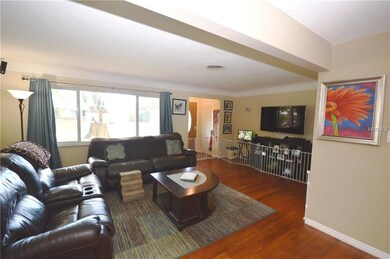 View of front door and family room from the dining
