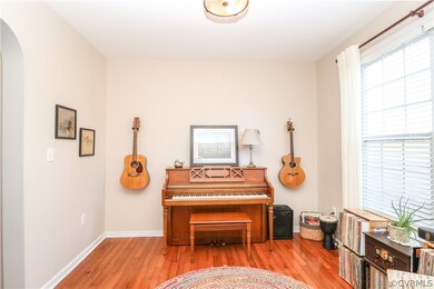 Formal dining room to the right of entry with arch