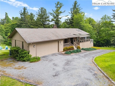 Circular driveway provides ample parking and  ease
