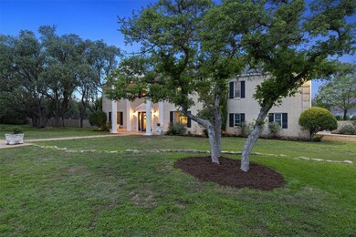 Greek revival inspired property featuring a front