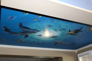 This custom hand painted mural welcomes guests int