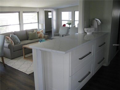 Note the Breakfast Bar looking out to Living Room 