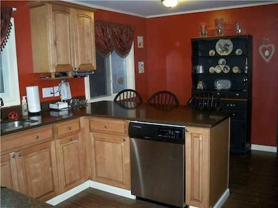 Kitchen. This view highlites the maple cabinetry, 