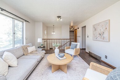 Living room featuring wood finished floors and a textured ceiling